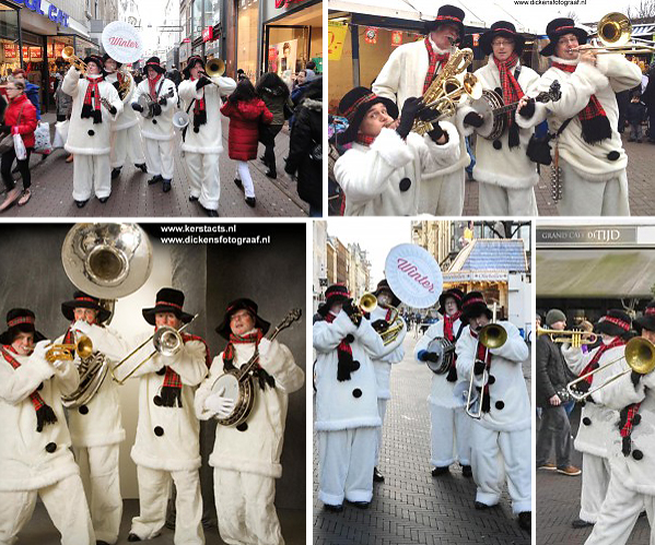 Sneeuwpoppen looporkest. Deze muzikanten vormen al jaren een hecht kwartet. Zij weten heel goed heel goed raad met de belangen van hun opdrachtgevers, en dus hebben zij ook Sneeuwpoppen kostuums laten vervaardigen, www.kerstacts.nl